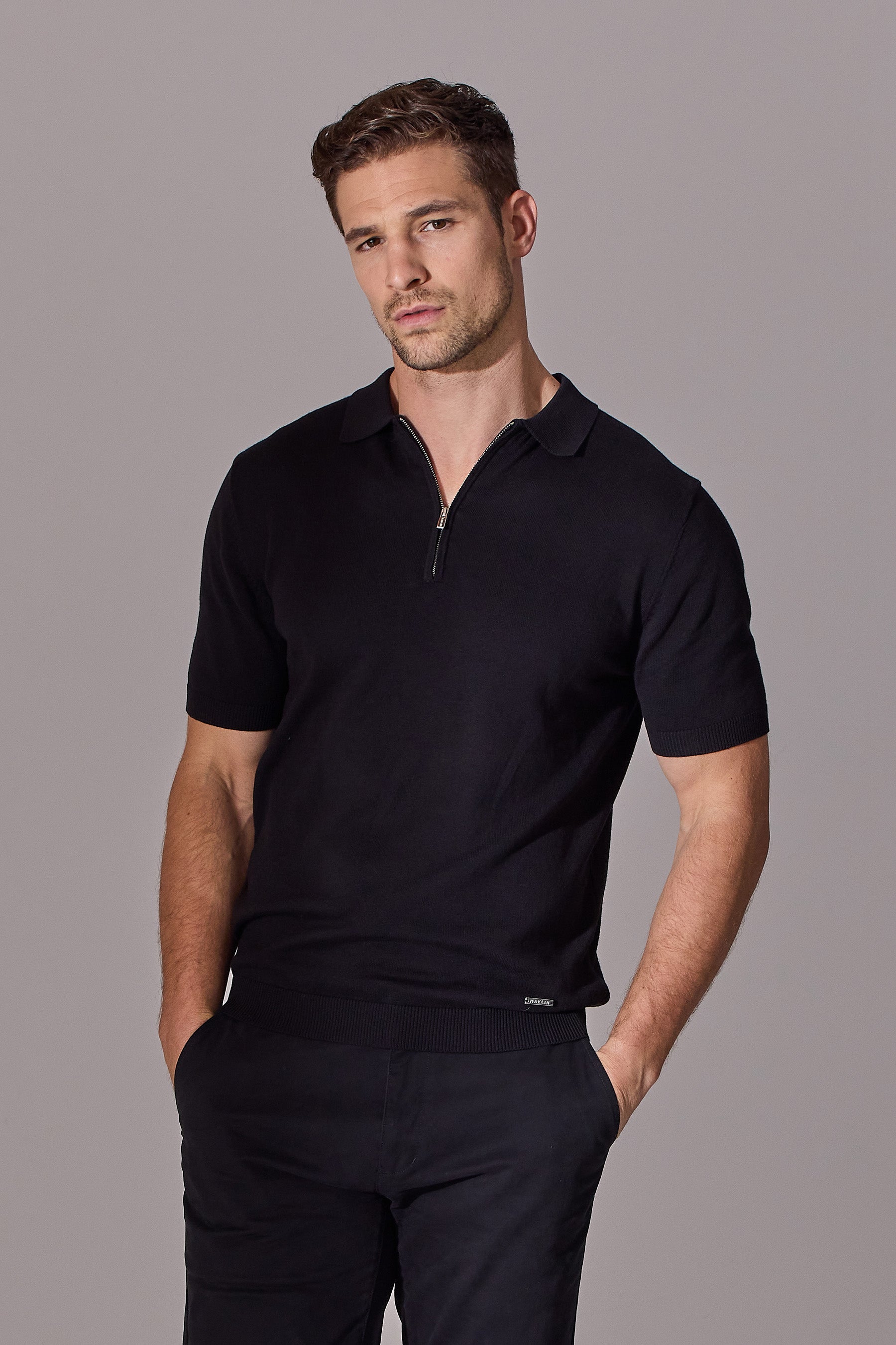 Short sleeve polo shirt for men in black. Zip collar. Maklin Clothing.