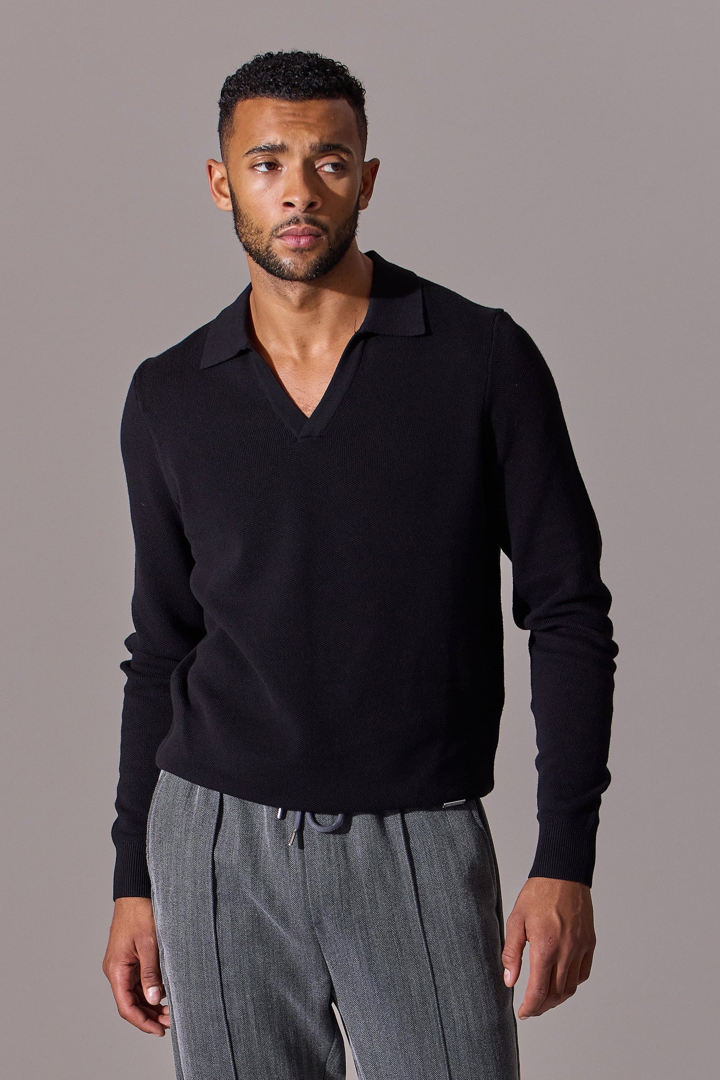Black long sleeve polo shirt for men. Open collar. Maklin Clothing