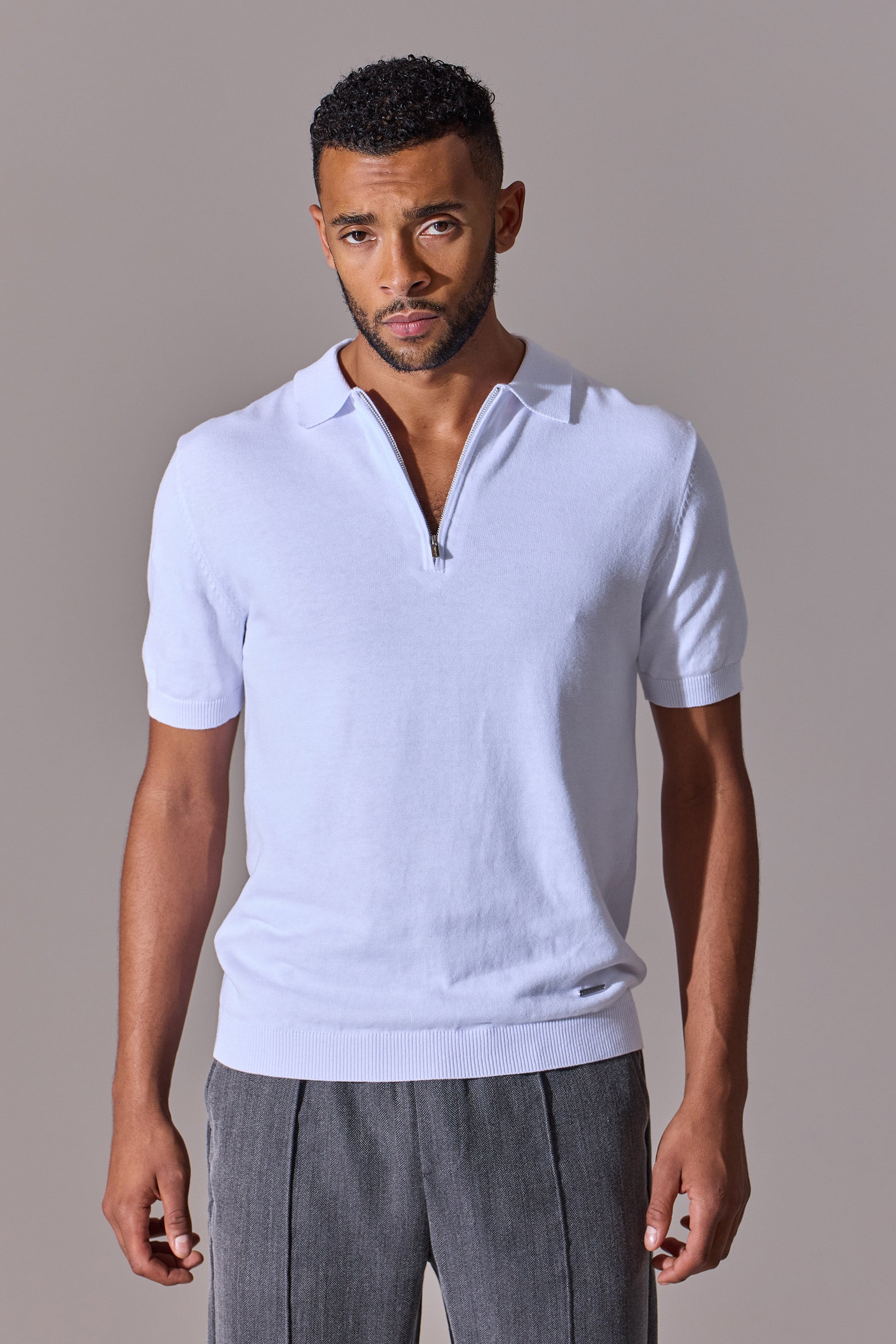 White short sleeve polo shirt for men. Zip collar. Maklin Clothing