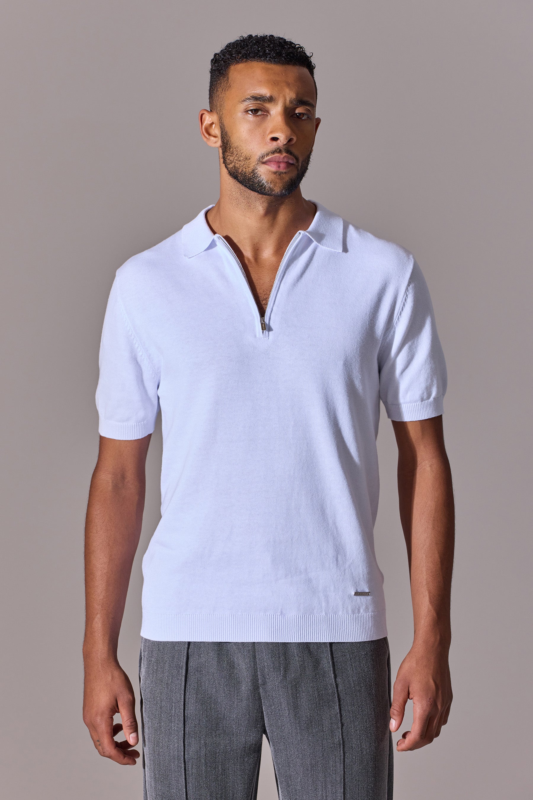 White polo shirt for men. Short sleeve, zip. Maklin Clothing.
