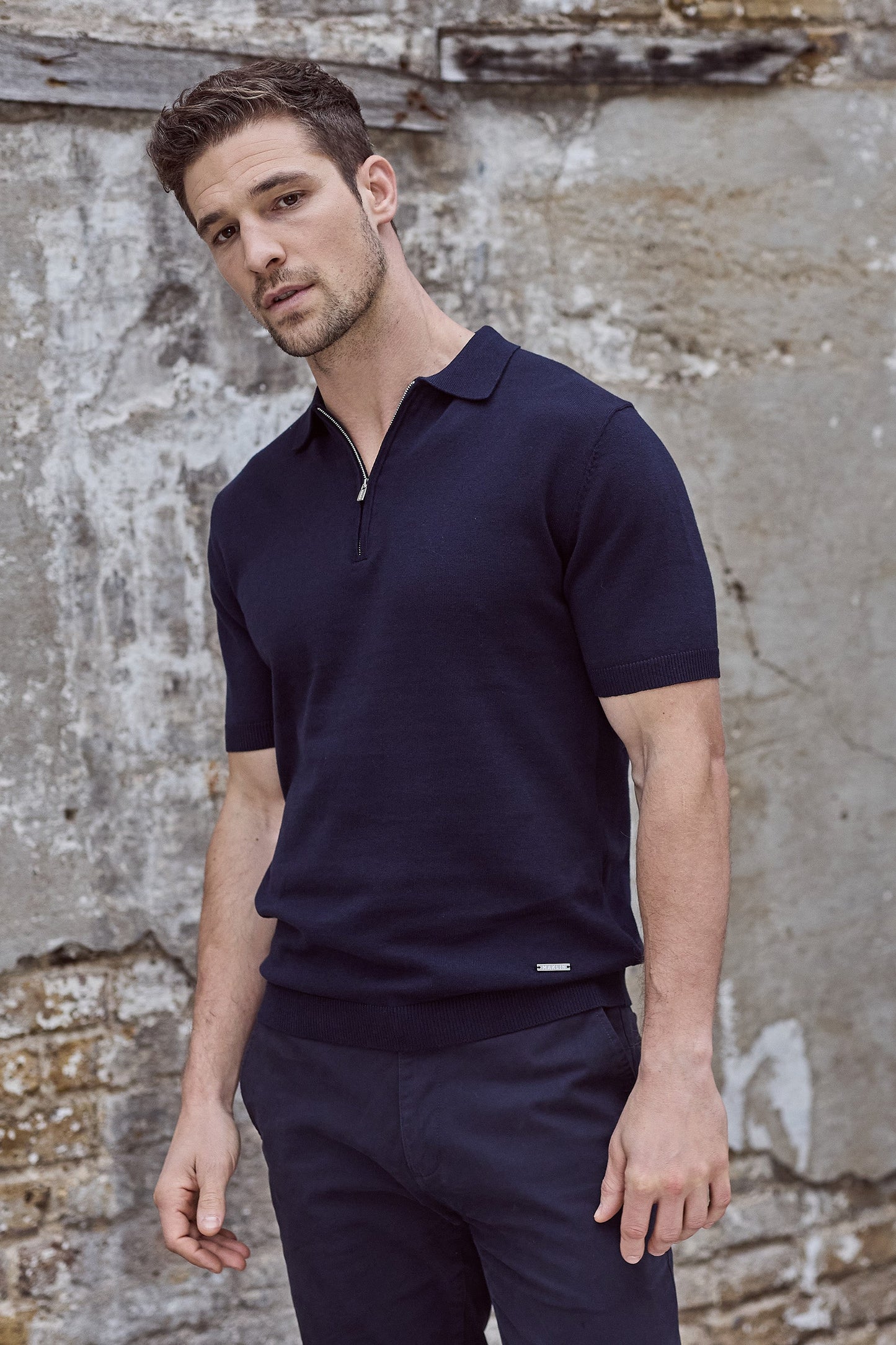 Navy blue polo shirt for men. Short sleeve, zip collar. Maklin Clothing.
